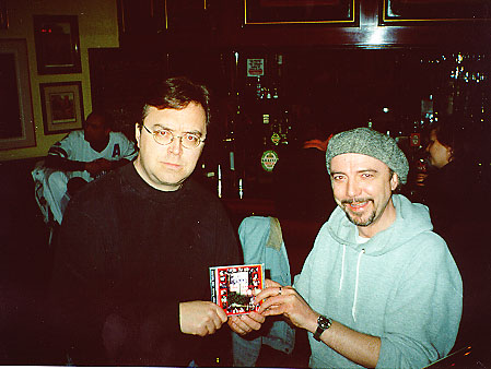 Stig Stilletto (l) presenting Pasquale Neutron (r) with a copy of the 20 Year Scam at the Toronto Launch bash